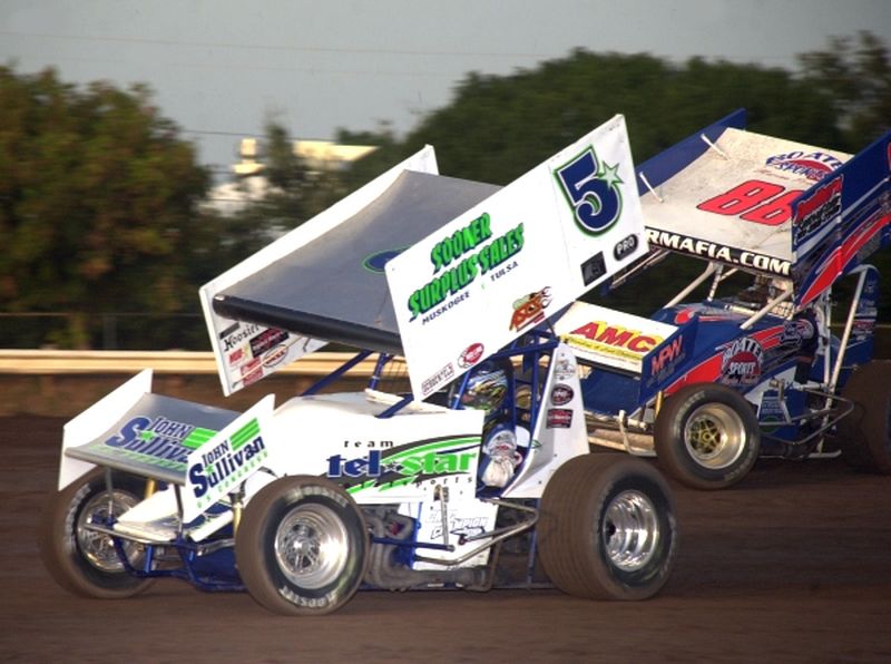 Gary Tayor (5*) races with Tim Crawley in Friday night's 16th Annual Toyota Tundra ASCS Sizzlin' Summer Speedweek action at Oklahoma City's State Fair Speedway.
