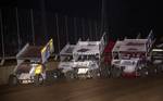 Claud Estes (74), Zach Chappell (50z) and J.J. Hickle (7) lead the three-wide salute prior to Saturday night's 16th Annual Toyota Tundra ASCS Sizzlin' Summer Speedweek main event featuring the O'Reilly American Sprint Cars on Tour at Little Rock's I-