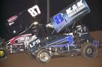Brian McClelland (87) and Zach Pringle (8z) battle for the lead in Saturday night's 25-lap American Bank of Oklahoma ASCS Sooner Region feature at Little Rock's I-30 Speedway