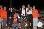 Charles Davis, Jr., and company enjoy Discount Tire Co. ASCS Canyon Region victory lane at Manzanita Speedway on Saturday night.