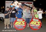 Joe Wood, Jr., and crew celebrate their third consecutive American Bank of Oklahoma ASCS Sooner Region feature win after Friday night's triumph at Kennedale Speedway Park near Fort Worth, TX.