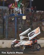 Jason Johnson races underneath the checkered flag to win Saturday night's 40-lap O'Reilly ASCoT National series Ronald Laney Memorial feature event at East Bay Raceway Park's 32nd Annual Winter Nationals in Tampa, FL.