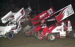 Brian McClelland (87) battles for the lead in ASCS Sooner Creek County Speedway