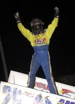 Travis Rilat celebrates his triumph in Saturday night's American Bank of Oklahoma ASCS Sooner Region feature at Cowtown Speedway in Kennedale, TX.